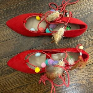 Red Shoes with Pom Poms and Feathers